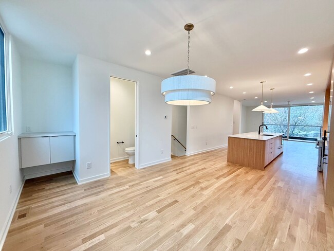 Building Photo - Luxurious New Construction 4BD, 2.5BA Raleigh Townhome with a Rooftop Terrace in a Prime Location...