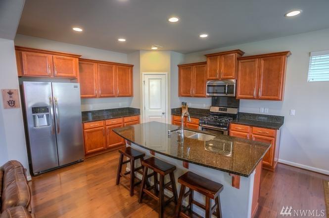 Spacious kitchen, with lots of granite. - 8828 Jayden Ln NE