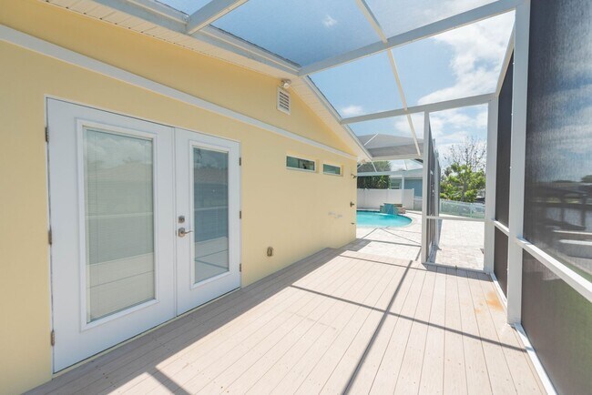 Building Photo - Live the ultimate Space Coast waterfront lifestyle at this stunning beachside canal home in Satel...