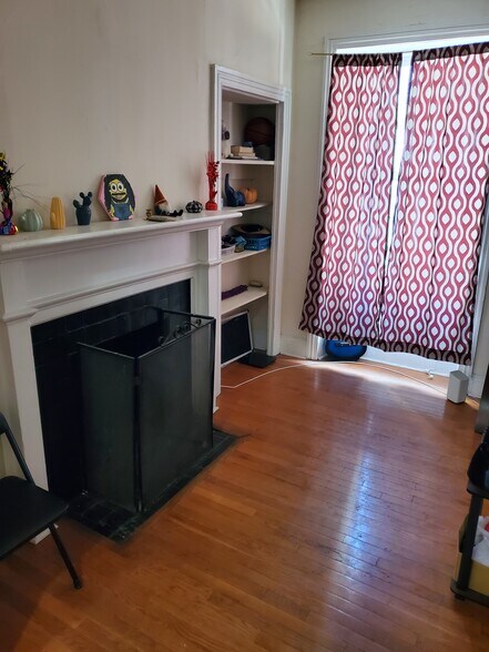 Built in bookshelves and fireplace create atmosphere - 112 S 20th St