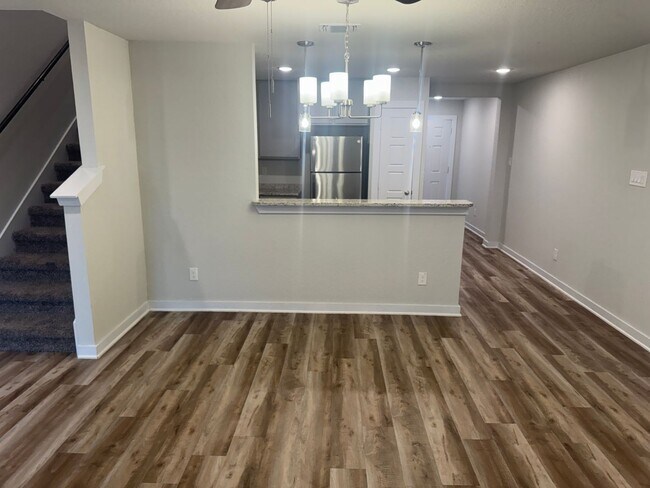 Building Photo - Stylish, Spacious & Close to It All – Your Ideal Townhome Awaits!