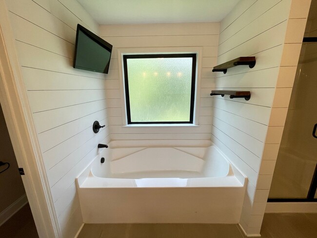 Building Photo - Whispering Pines 4 Bedroom 3.5 Bathroom Re...