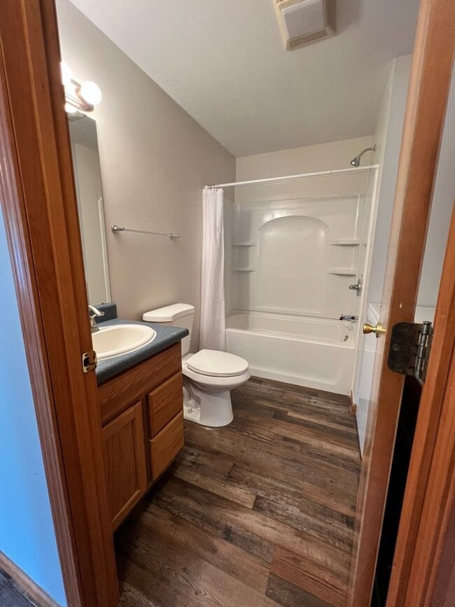 Building Photo - Spacious 3BR Duplex with Finished Basement & 2-Car Garage in Otsego