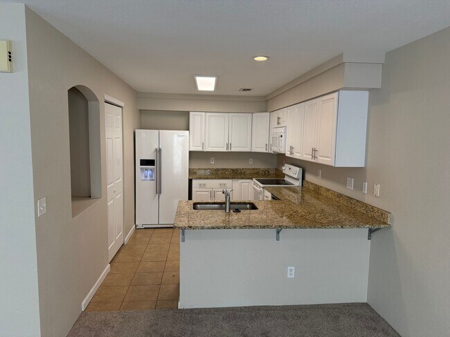 Building Photo - Spacious 4-bed, 3-bath home on a quiet cul-de-sac — no lawn maintenance required.