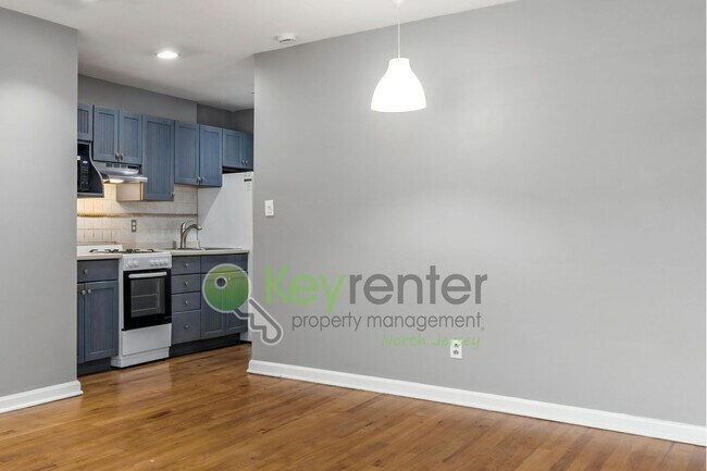 Building Photo - Quiet 2nd-Floor 1BR Condo – Updated Bath, Pet Friendly & Easy NYC Commute