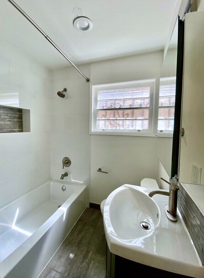 Fully renovated bathroom with modern finishes. - 1672 Rotary Dr