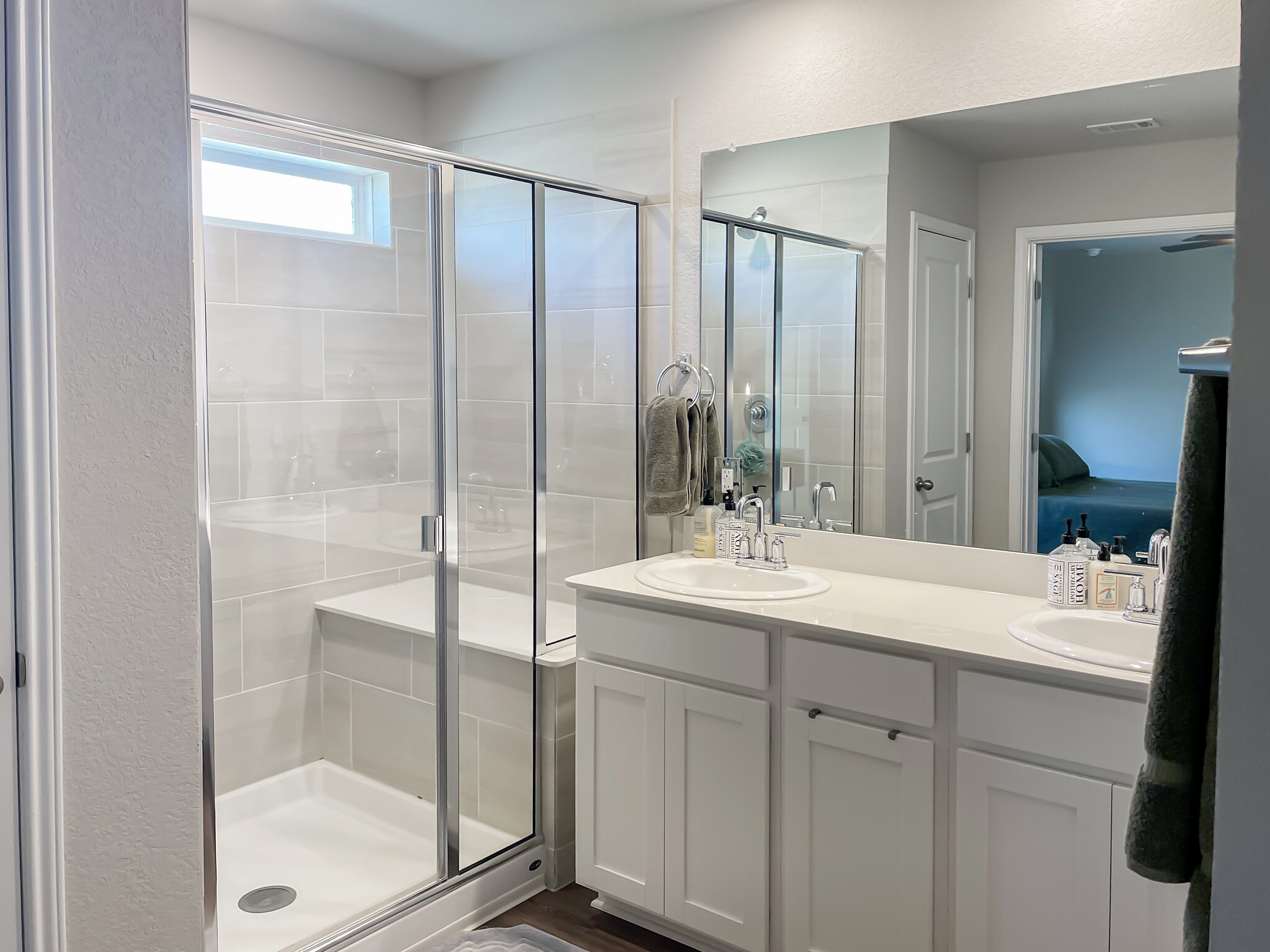 Double vanities, large shower with bench seat, separate toilet area, and large walk-in closet - 897 Lone Peak Way