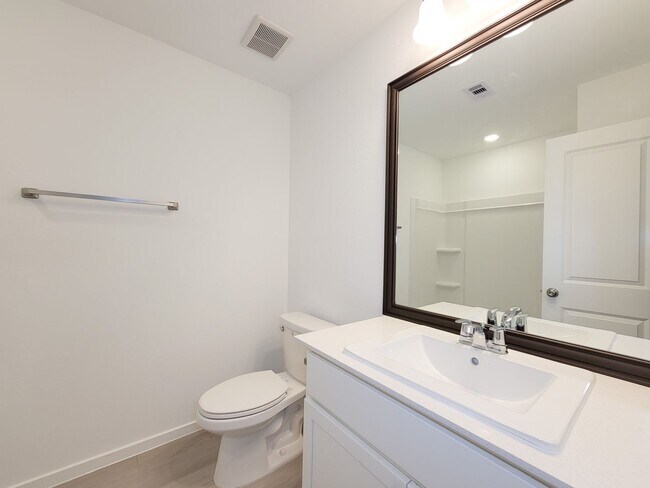 Building Photo - This single-level home showcases a spacious open floorplan shared between the kitchen, dining are...