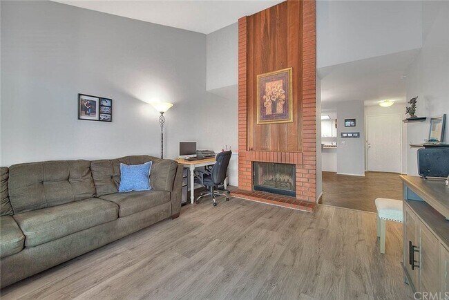 Large living room with fireplace and open floor plan - 1073 S Romney Dr