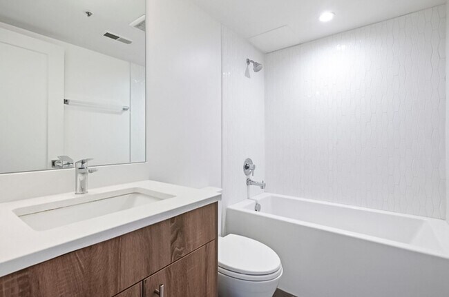 Building Photo - 2BR Condo w/ Covered Parking and Balcony Views at Broadway Towers