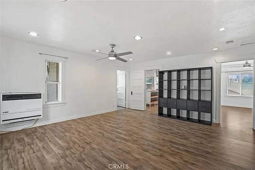 living room leading into bathroom and kitchen - 418 E 14th St