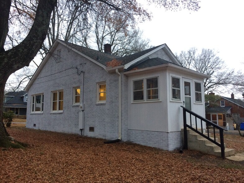 Sunroom style laundry room with rear entrance into home. - 361 W Wilson Ave