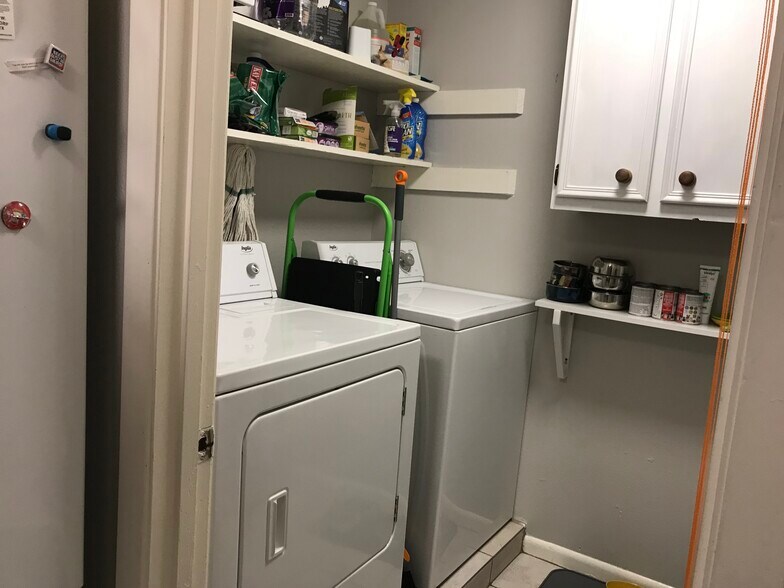 Full size washer/dryer and storage/pantry area - 3312 S Oak Dr