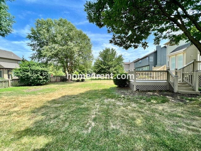 Building Photo - Updated Kitchen, Large Two Tiered Deck, Finished Basement in Blue Valley Schools!