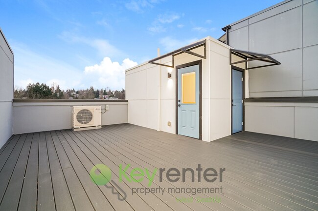 Building Photo - Rooftop Living with Open Concept Design and Parking Included