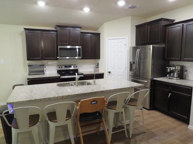 Building Photo - "Charming 3-Bedroom Home with Elegant Gran...
