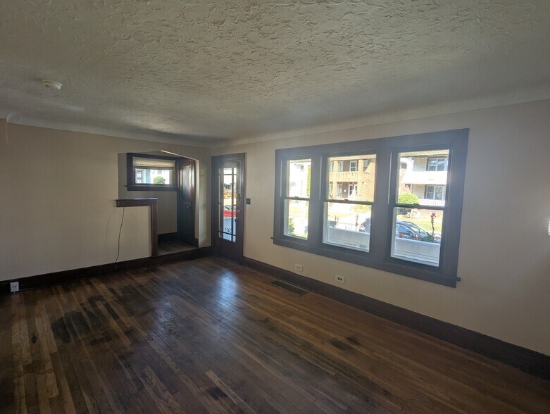 lviving room with large front windows - 2401 Natchez Ave