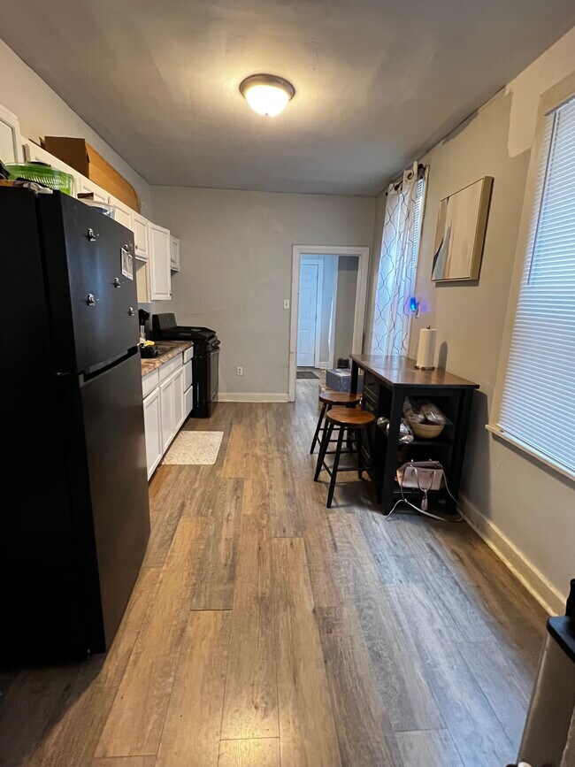 Eat in kitchen with door to the backyard/parking - 511 W Philadelphia St