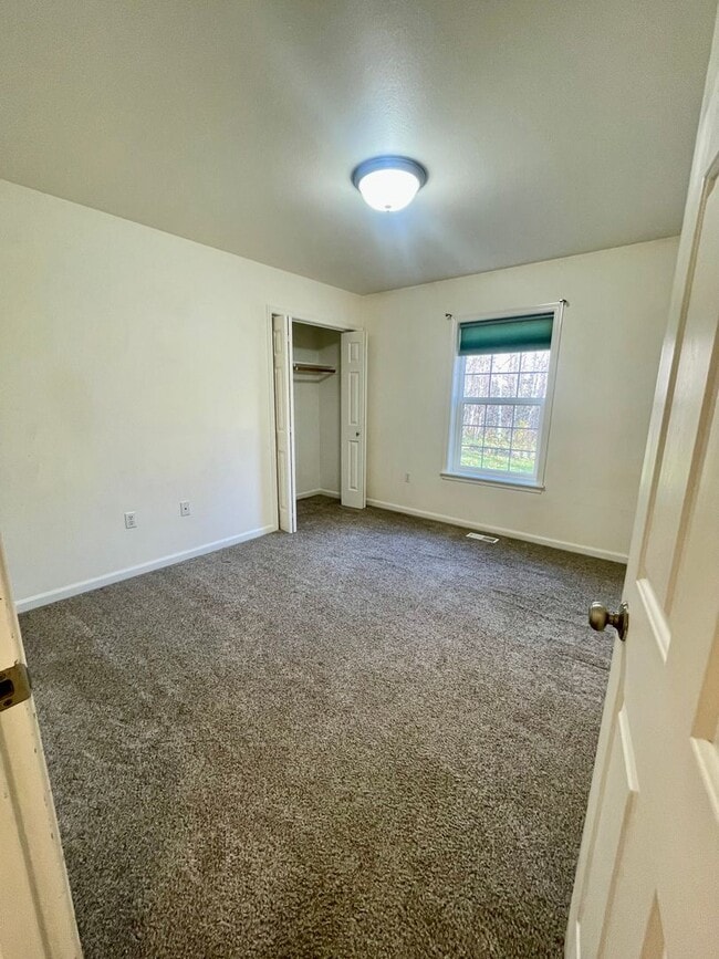 Building Photo - Ranch style 3bedroom/2 bathroom with an Oversized two car garage +giant carport!  Large private l...