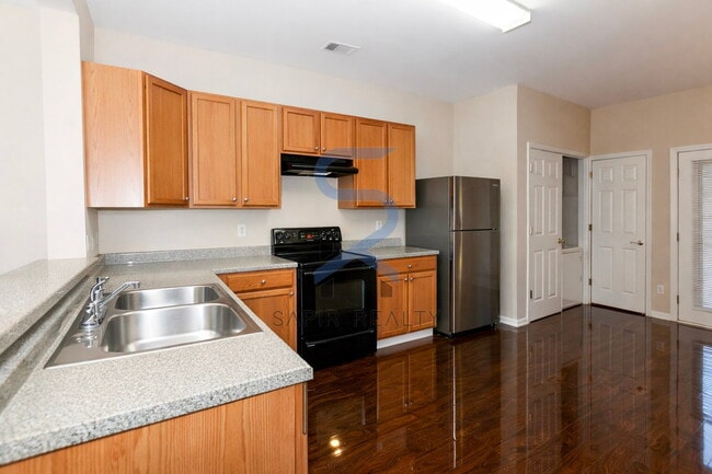 Building Photo - Move in before February 28th and choose your reward: a $250 Amazon Gift Card or a 55" Smart TV!