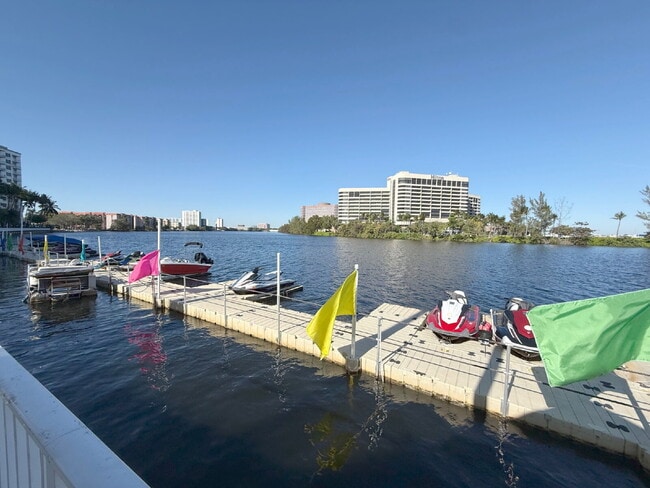 Building Photo - Rare 2/2 Corner Penthouse with Panoramic Lagoon Views from Every Room – Available Now!