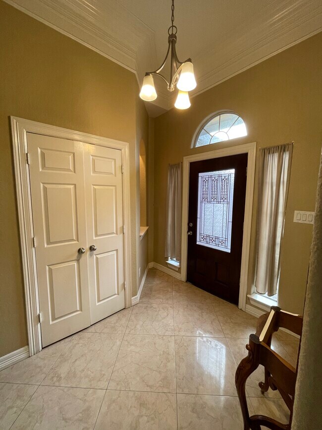 Main entrance/foyer with coats closet - 600 River Bend Dr