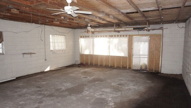 Building Photo - Four Bed - Three Bath - Large Storage Area...