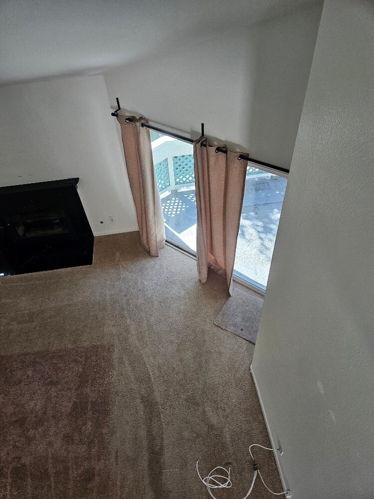 looking down from the loft to living room, balcony - 7532 Seaspring Dr