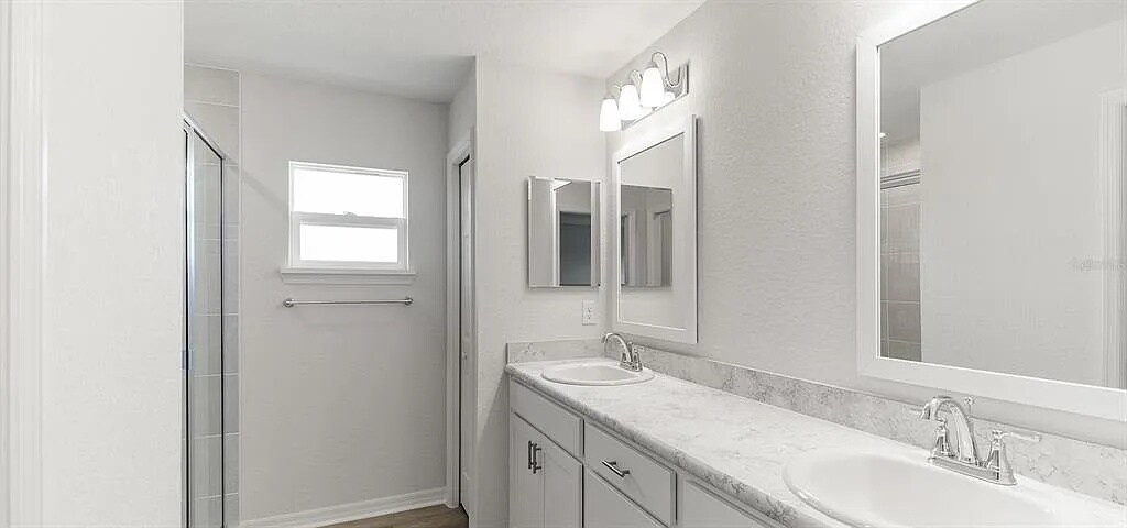 Shower owners bathroom with natural light - 7675 SE 114th St