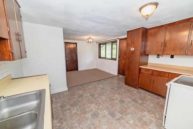 kitchen opens up to dining room with new carpets - 22 Muckey Rd