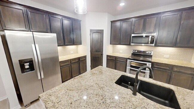 Building Photo - Welcome home to this beautifully designed 4-bedroom, 2.5-bathroom gem!