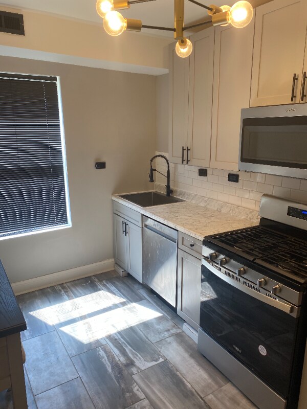 Building Photo - 1301 E 71st Pl