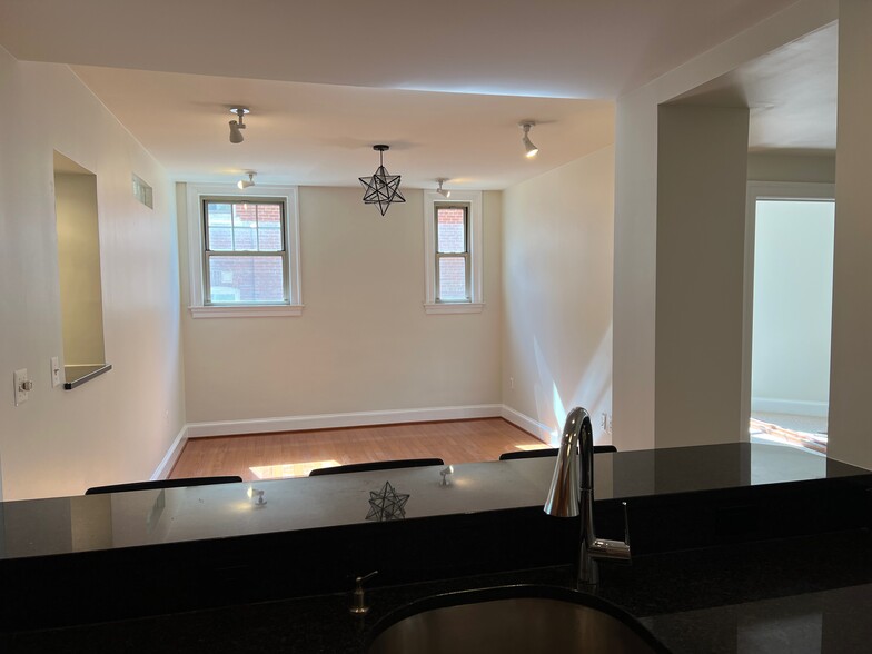 View from Kitchen Sink -- living room and door to primary bedroom - 3220 17th St NW