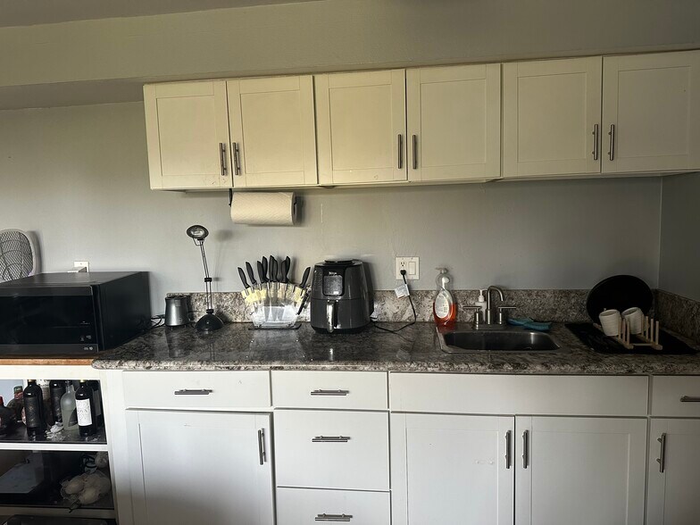 bar area with cabinetary and sink - 2300 Sunset Heights Dr