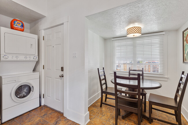 Stack washer and dryer and kitchen nook eating area. Rear door exits out to mudroom and back yard. - 717 E Lakeside Ave