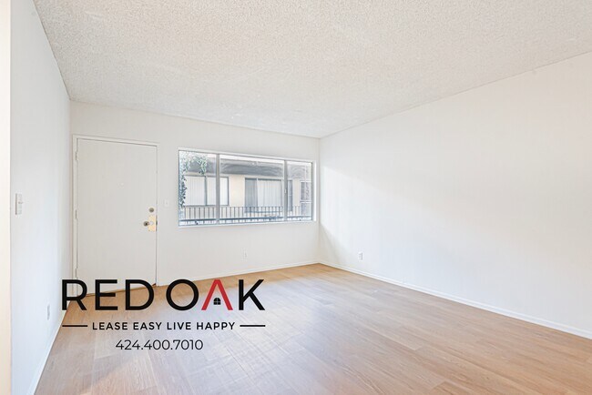 Building Photo - Charming One Bedroom with Sunlit Open Floo...