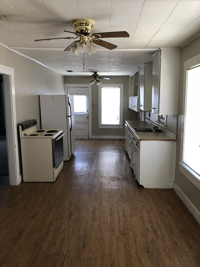 Roomy kitchen. Door at end leads into backyard. - 1615 Kenwood