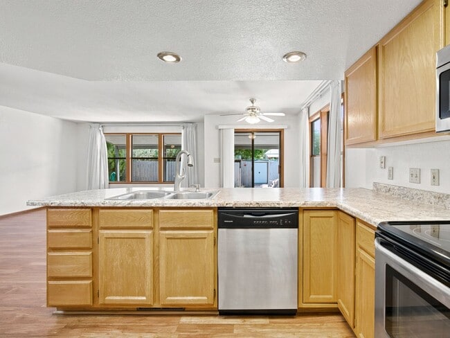 Building Photo - Spacious 2BR Rental with Open Floor Plan & Low-Maintenance yard