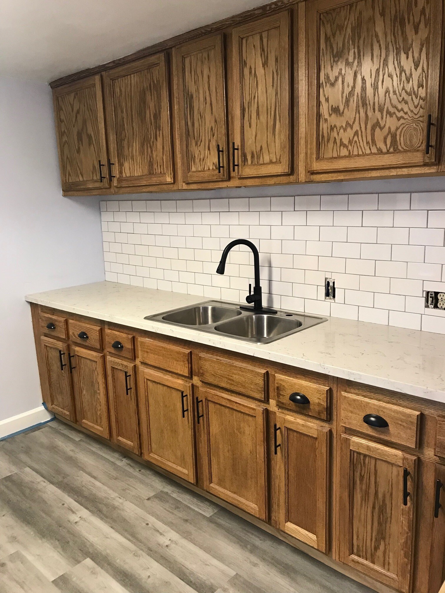 Kitchen with quartz countertops, subway tile backsplash and dishwasher - 2612 F St