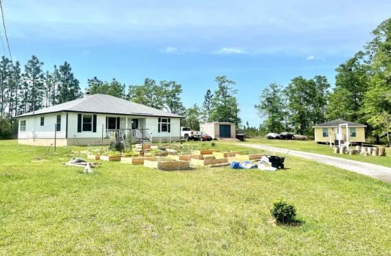 Our main house (white) and guest house for rent (yellow) - 3399 Wild Turkey Rd