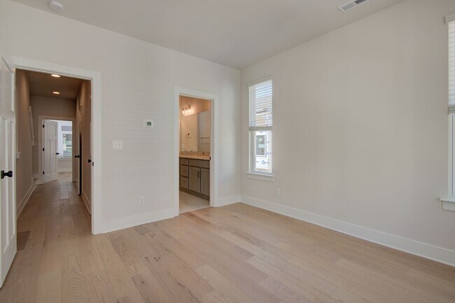 Building Photo - COMING SOON! Modern End-Unit Living Near Uptown | Rooftop Terrace + Tandem Garage