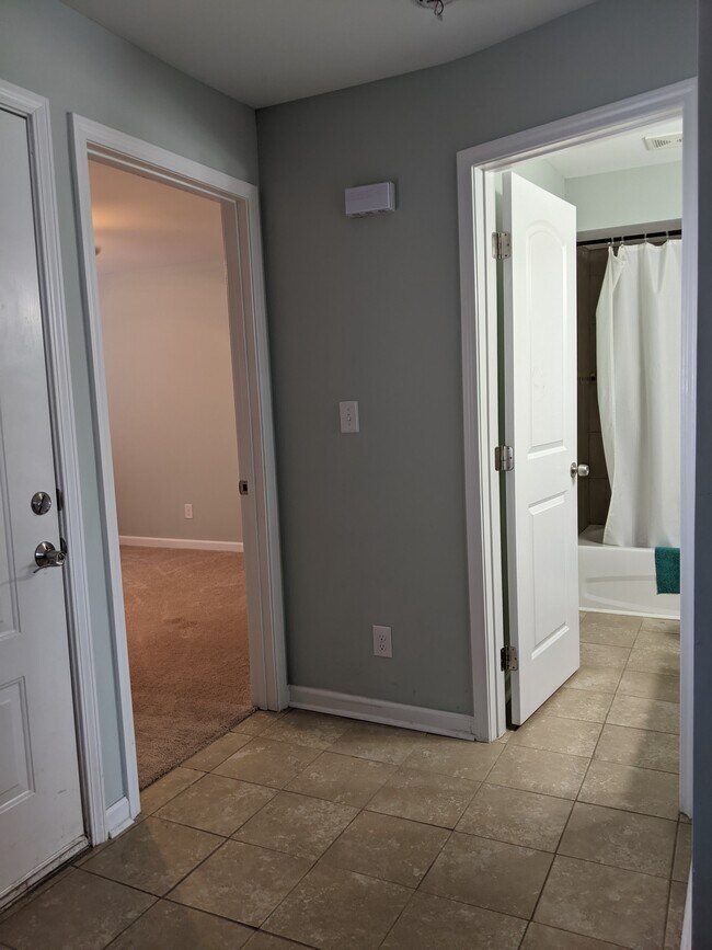 The first bedroom and bathroom open off the kitchen and entrance. - 2414 Lake Park Rd