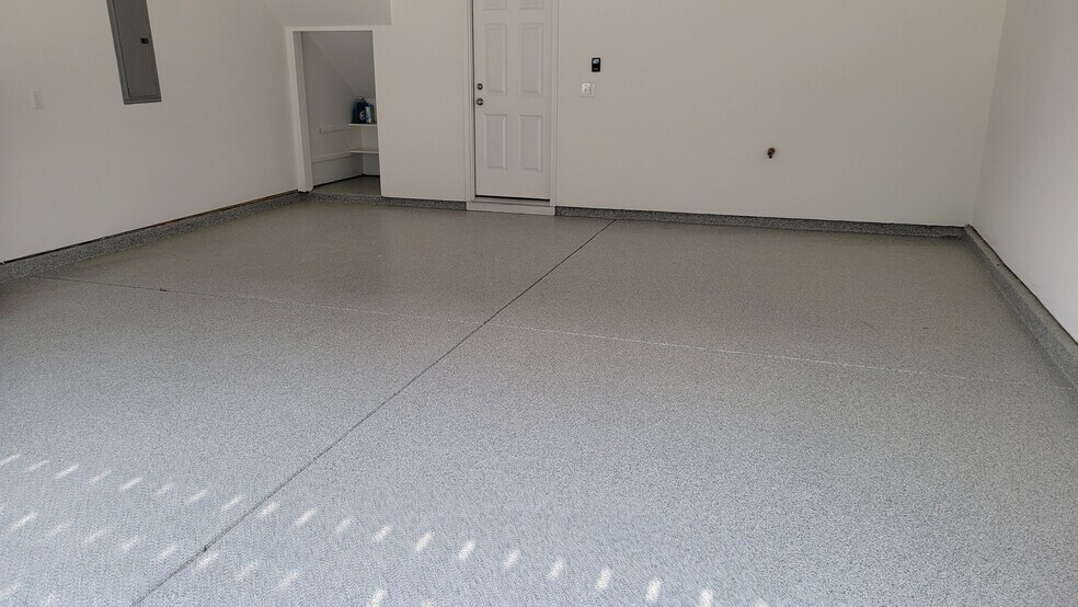 Garage - flooring coated and small storage area - 506 Village Branch Ln