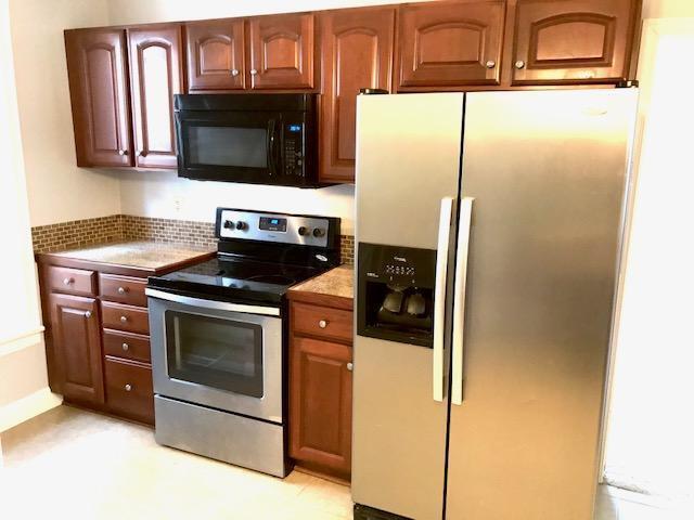 Kitchen and staircase is around the corner. - 711 E 6th Ave