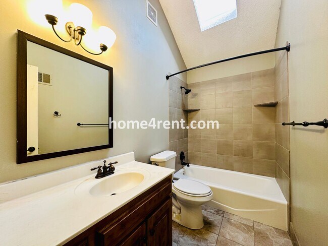 Building Photo - Maintenance Free Living w/ Hardwood Floors...