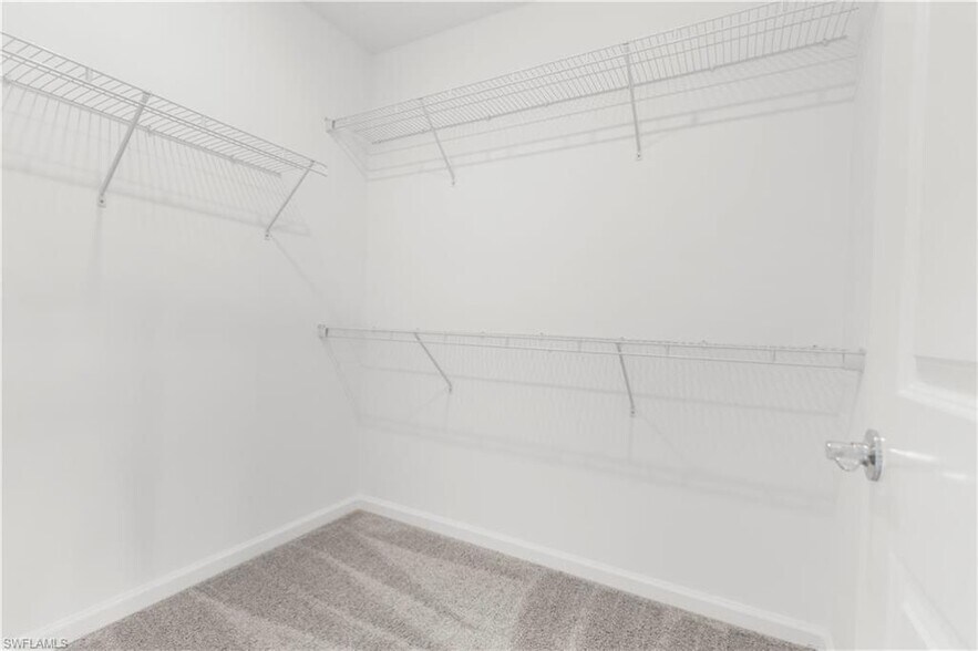 primary closet - 27865 Solis Grande Dr