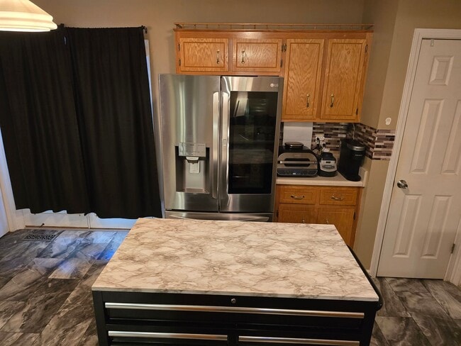 Building Photo - Pet Friendly Three Bedroom with Bonus!