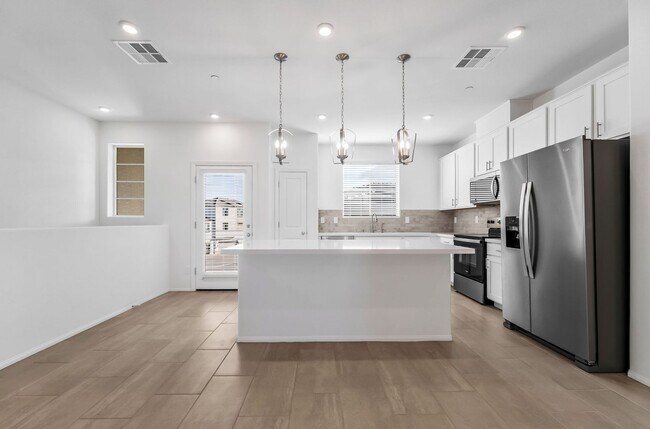 Building Photo - Modern Cadence Townhome with Open-Concept Living & Energy-Efficient Features!