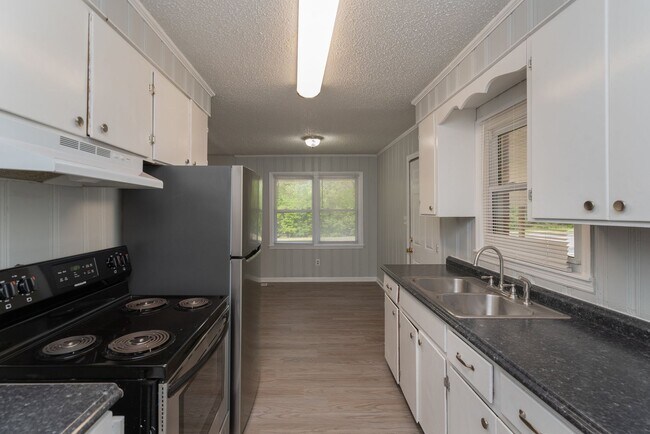 Building Photo - Freshly Updated 3BR with New LVP Flooring, Energy-Efficient Windows & Spacious Fenced Backyard