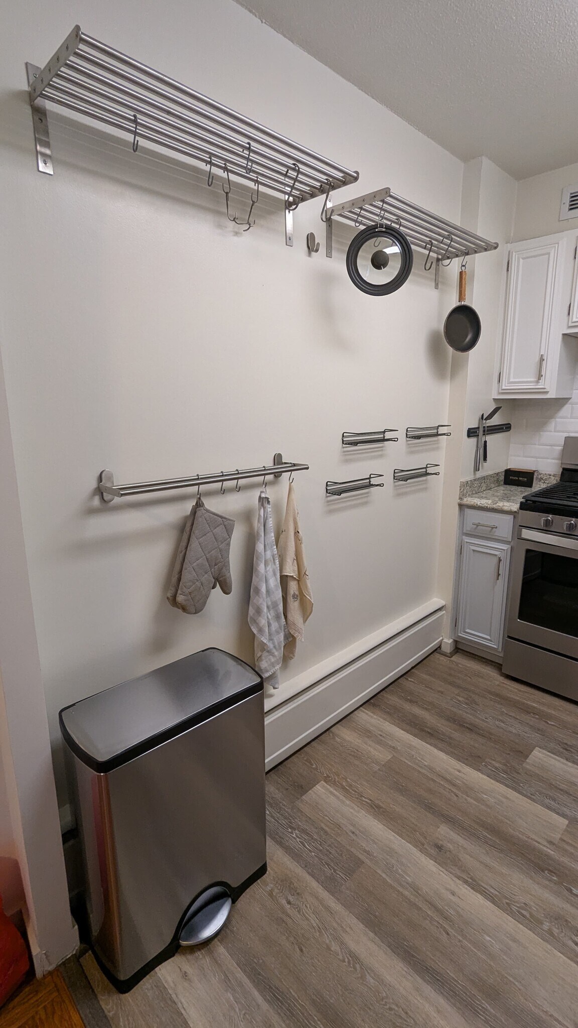 Built-in storage for hanging pots, pans, spices, knives, and towels/mitts. - 490 M St SW